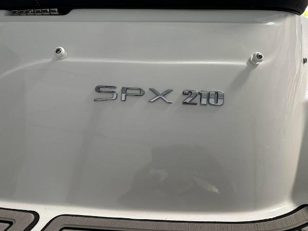 Slide: The Image of 2024 Sea Ray 210 SPX OB boat model nameplate. - 1