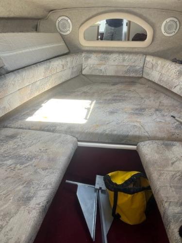 Slide: The Image of Interior of 1996 Sea Ray Sundancer boat with anchor and yellow bag. - 11