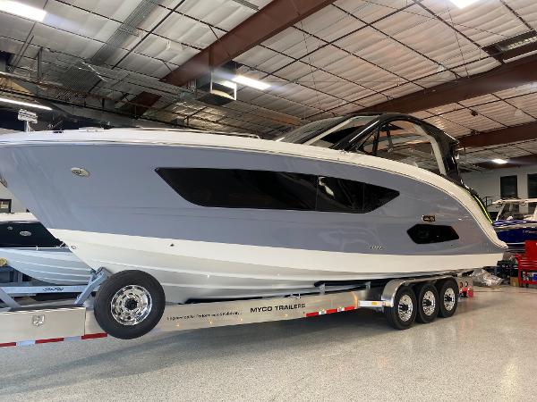 Slide: The Image of 2025 Sea Ray Sundancer 370 OB on a Myco trailer in a showroom. - 26