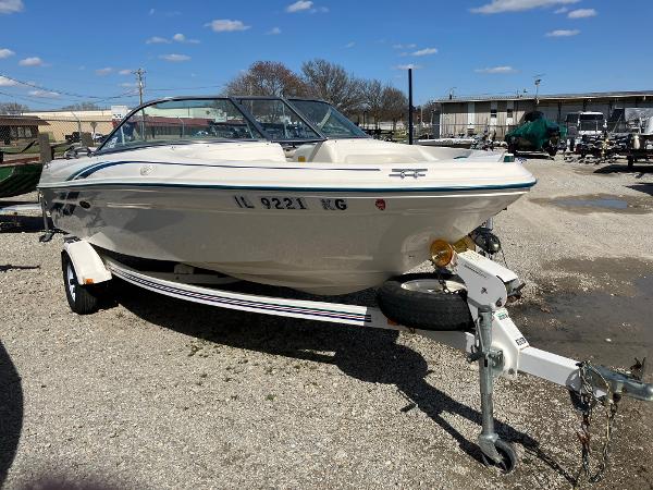 Slide: The Image of 1998 Sea Ray V180 boat on trailer in outdoor lot. - 1