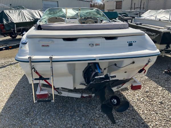 Slide: The Image of 1998 Sea Ray V180 boat, rear view, parked on gravel lot. - 3