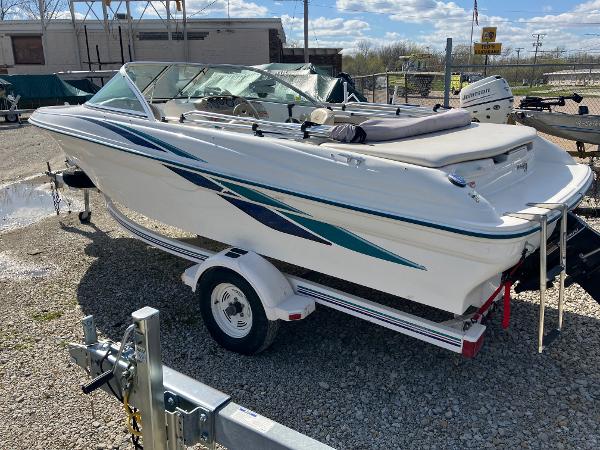 Slide: The Image of 1998 Sea Ray V180 boat on trailer in outdoor storage area. - 4