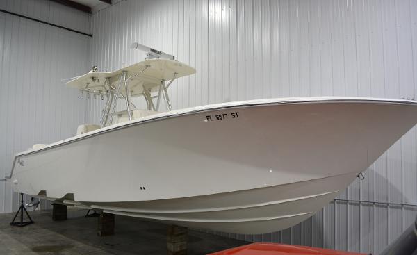 Slide: The Image of 2020 SeaVee 322z boat in storage, showcasing sleek design and white hull. - 0