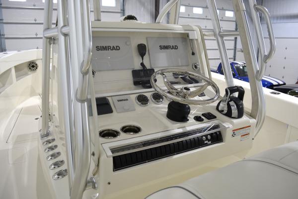 Slide: The Image of 2020 SeaVee 322z boat console with Simrad electronics and steering wheel. - 12