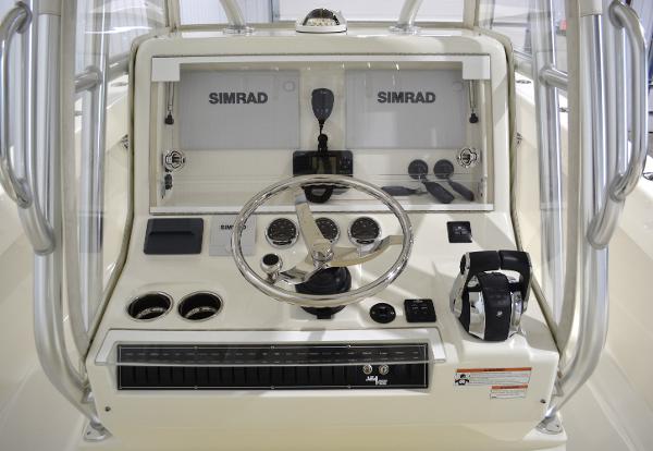 Slide: The Image of 2020 SeaVee 322z boat dashboard with Simrad electronics and steering wheel. - 13
