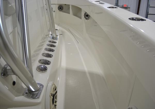 Slide: The Image of 2020 SeaVee 322z boat interior with rod holders and speakers. - 16
