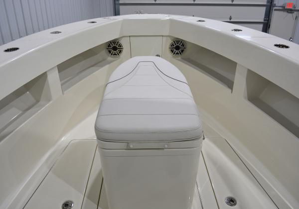 Slide: The Image of 2020 SeaVee 322z boat interior with white seating and storage compartments. - 19