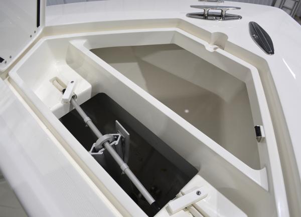 Slide: The Image of 2020 SeaVee 322z boat storage compartment with open hatch and cleat. - 23