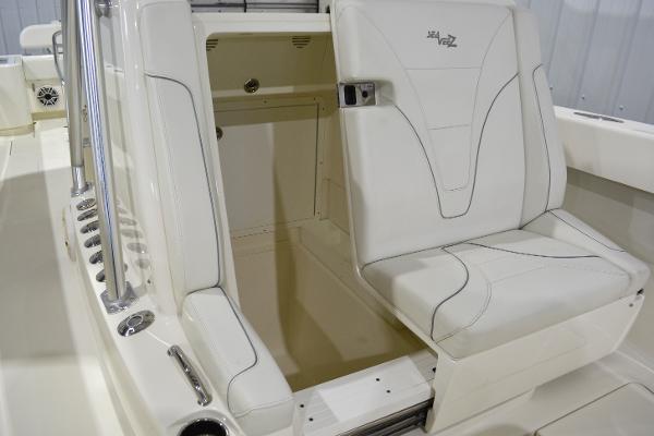 Slide: The Image of 2020 SeaVee 322z boat interior with white seating and storage compartment. - 28