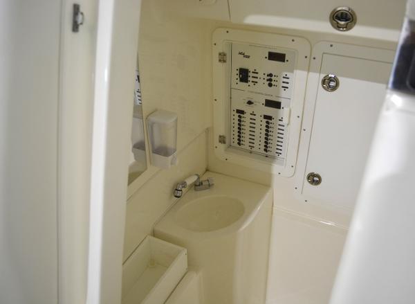 Slide: The Image of 2020 SeaVee 322z boat interior with control panel and sink. - 29