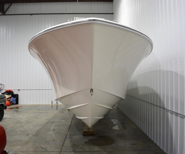 Slide: The Image of 2020 SeaVee 322z boat in storage, front view, white hull. - 3