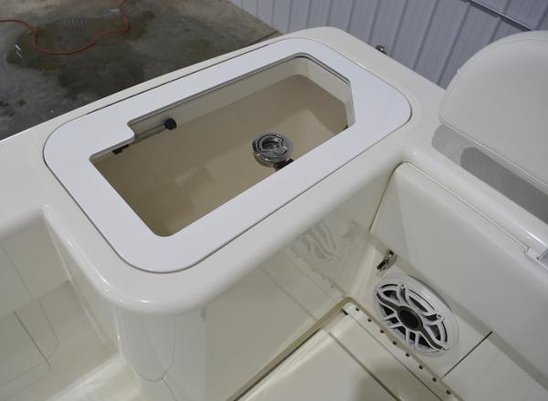 Slide: The Image of 2020 SeaVee 322z boat interior with storage compartment and speaker. - 34