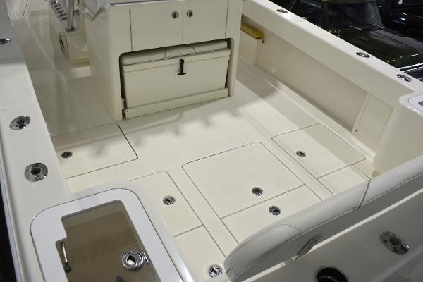 Slide: The Image of 2020 SeaVee 322z boat deck with storage compartments and seating. - 4