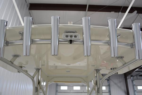 Slide: The Image of 2020 SeaVee 322z boat with multiple rod holders in a storage facility. - 7