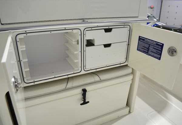 Slide: The Image of 2020 SeaVee 322z storage compartments with open drawers and shelves. - 8