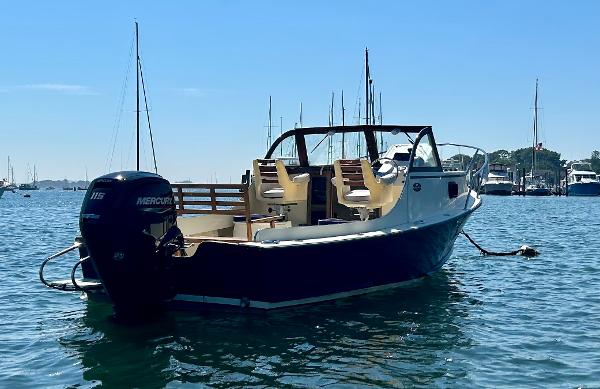 Slide: The Image of 2021 Seaway 21 Seafarer Cuddy boat on water, featuring Mercury outboard motor. - 1