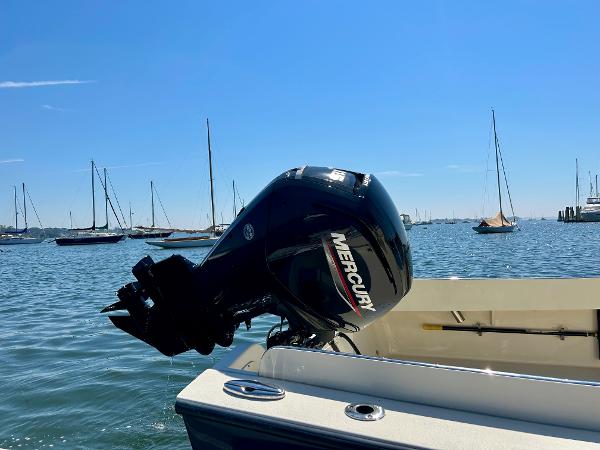 Slide: The Image of 2021 Seaway 21 Seafarer Cuddy with Mercury outboard motor on calm water. - 13