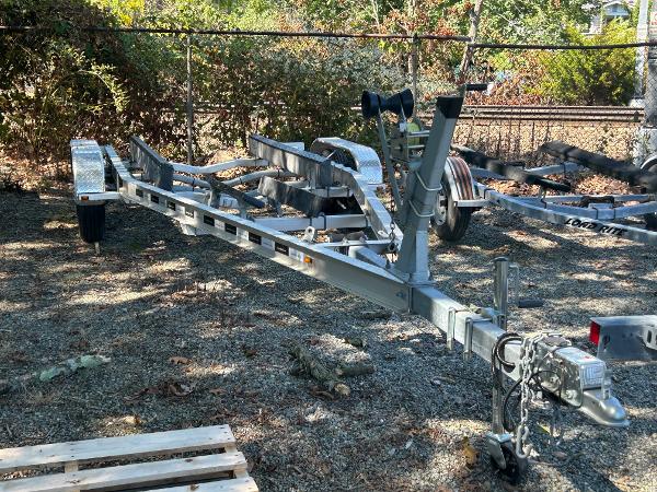 Slide: The Image of Boat trailer for 2021 Seaway 21 Seafarer Cuddy, parked on gravel. - 14