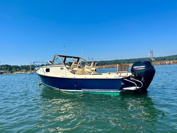 Slide: The Image of 2021 Seaway 21 Seafarer Cuddy boat on water, clear sky background. - 3