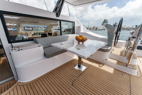 Slide: The Image of Luxurious 2024 Seawind 1600 yacht interior with modern seating and dining area. - 1