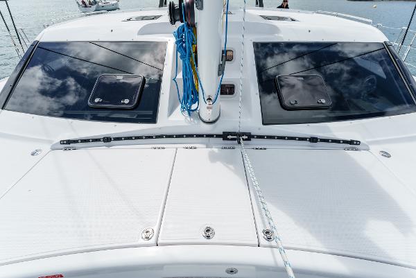 Slide: The Image of 2024 Seawind 1600 catamaran deck with sleek design and modern features. - 12