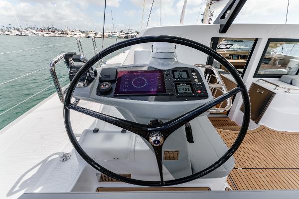 Slide: The Image of 2024 Seawind 1600 yacht helm with modern navigation instruments and sleek design. - 17