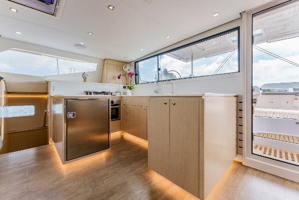 Slide: The Image of Modern kitchen interior of 2024 Seawind 1600 catamaran with sleek design and ample natural light. - 24