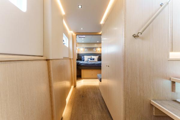 Slide: The Image of Luxurious interior of 2024 Seawind 1600 catamaran with modern lighting and cozy bedroom. - 28