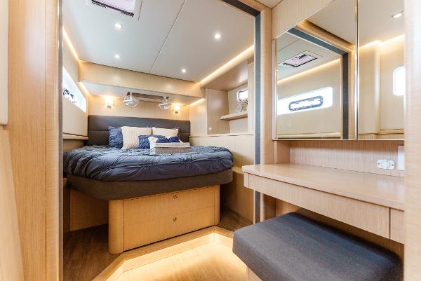Slide: The Image of Luxurious cabin interior of 2024 Seawind 1600 yacht with modern design and cozy bedding. - 29