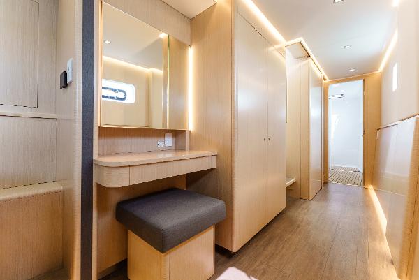 Slide: The Image of Luxurious interior of 2024 Seawind 1600 yacht with modern wood finish and seating area. - 30