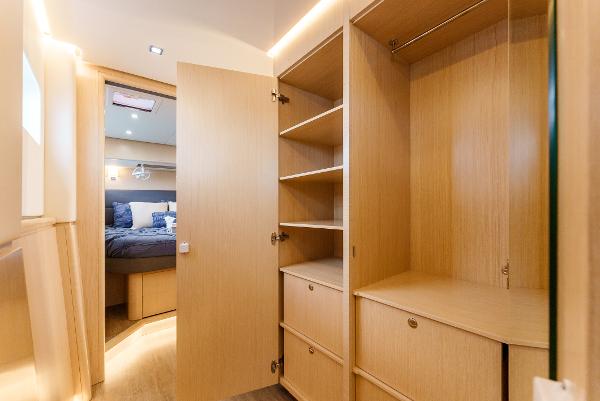 Slide: The Image of Luxurious interior of 2024 Seawind 1600 yacht with spacious wooden cabinetry. - 32