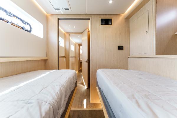 Slide: The Image of Interior of 2024 Seawind 1600 catamaran with twin beds and modern design. - 41