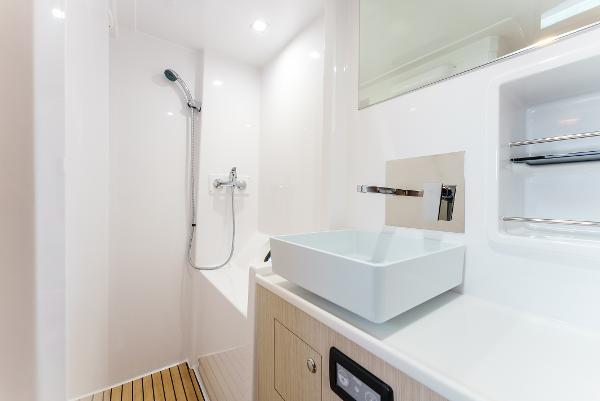 Slide: The Image of Modern bathroom in 2024 Seawind 1600 yacht with sleek fixtures and white basin. - 43