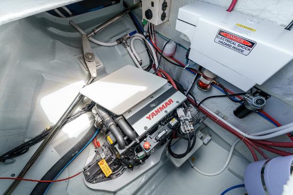 Slide: The Image of Engine compartment of 2024 Seawind 1600 catamaran with Yanmar engine and electrical components. - 45