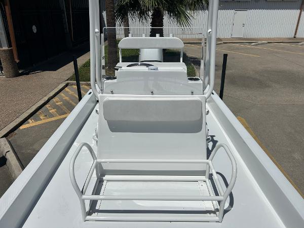 Slide: The Image of 2024 Shallow Sport 18 Sport boat, white interior, center console, outdoor setting. - 15