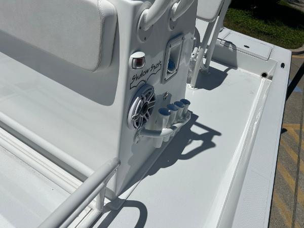 Slide: The Image of 2024 Shallow Sport 18 Sport boat console with speaker and rod holders. - 16