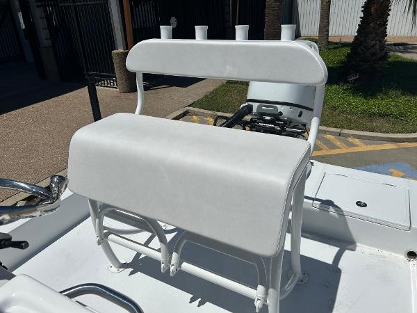 Slide: The Image of 2024 Shallow Sport 18 Sport boat with white cushioned seating. - 17