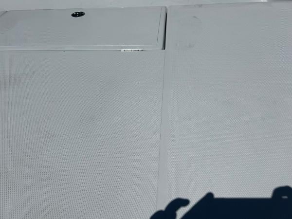 Slide: The Image of 2024 Shallow Sport 18 Sport boat deck with storage compartment. - 18