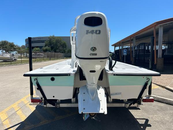 Slide: The Image of 2024 Shallow Sport 18 Sport boat rear view with 140 HP engine. - 4