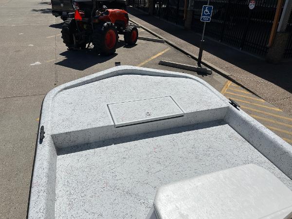 Slide: The Image of 2024 Shallow Stalker CAT-204 boat on a trailer in a parking lot. - 10