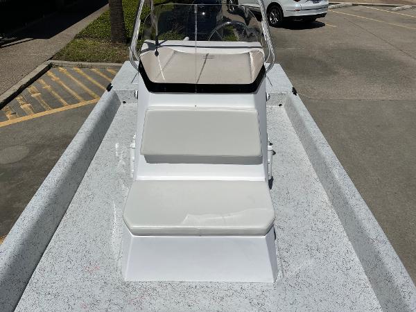 Slide: The Image of 2024 Shallow Stalker CAT-204 boat with white seating and windshield. - 11