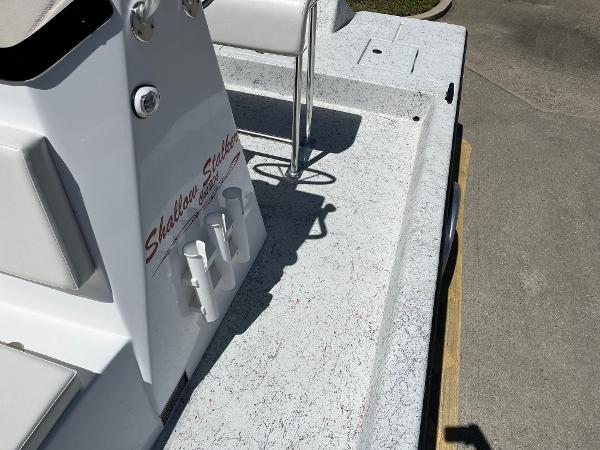 Slide: The Image of 2024 Shallow Stalker CAT-204 boat deck with rod holders and seating. - 13