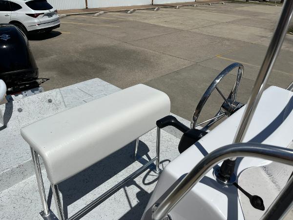 Slide: The Image of 2024 Shallow Stalker CAT-204 boat interior with steering wheel and seating. - 15
