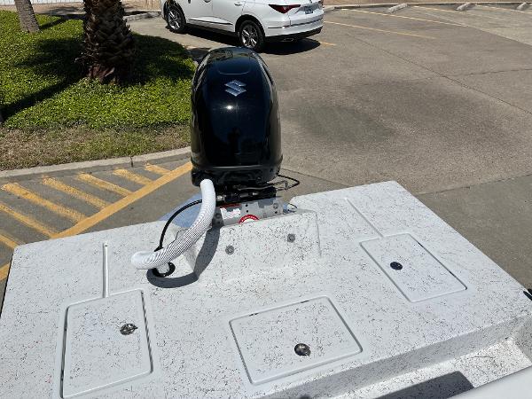 Slide: The Image of 2024 Shallow Stalker CAT-204 boat with outboard motor in parking lot. - 18