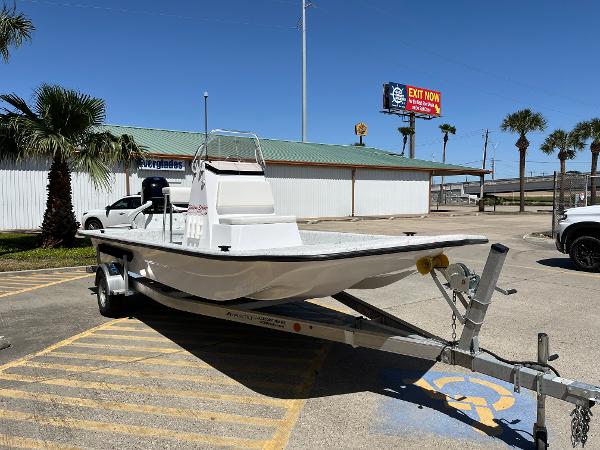 Slide: The Image of 2024 Shallow Stalker CAT-204 boat on a trailer in a parking lot. - 3