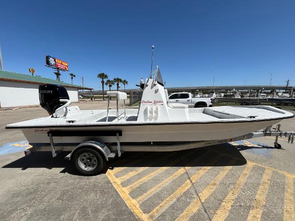 Slide: The Image of 2024 Shallow Stalker CAT-204 boat on trailer in parking lot. - 4