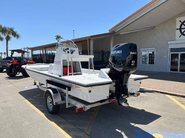 Slide: The Image of 2024 Shallow Stalker CAT-204 boat with Suzuki 140 outboard motor on trailer. - 7