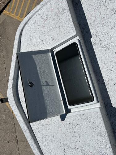 Slide: The Image of Open storage compartment on 2024 Shallow Stalker CAT-204 boat. - 8