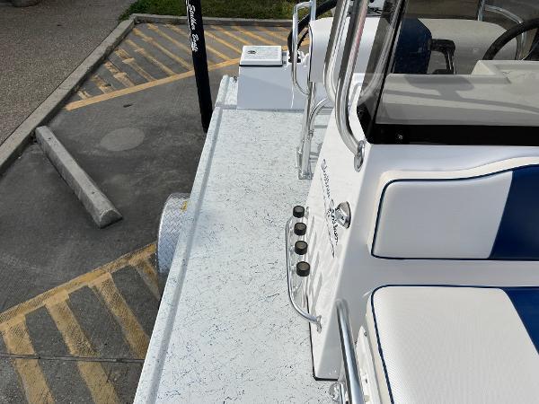 Slide: The Image of 2024 Shallow Stalker SS-17 Sportsman boat interior with white and blue seating. - 10