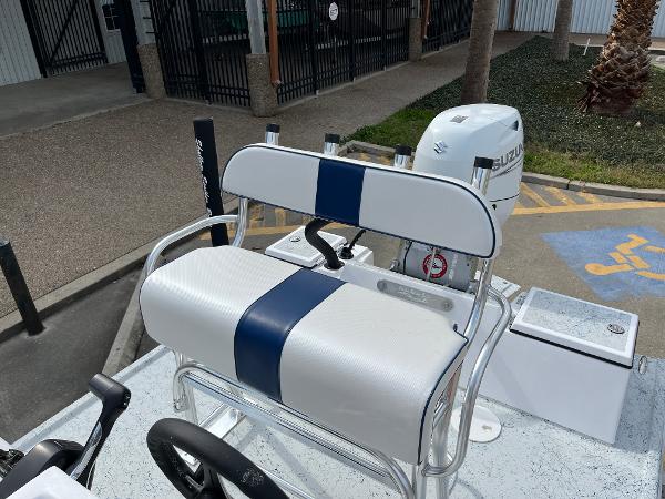 Slide: The Image of 2024 Shallow Stalker SS-17 Sportsman boat with Suzuki outboard motor and white-blue seating. - 14